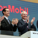 Exxon Mobil CEO Darren Woods applauds on the New York Stock Exchange in 2017. It's unclear when he'll be invited again.